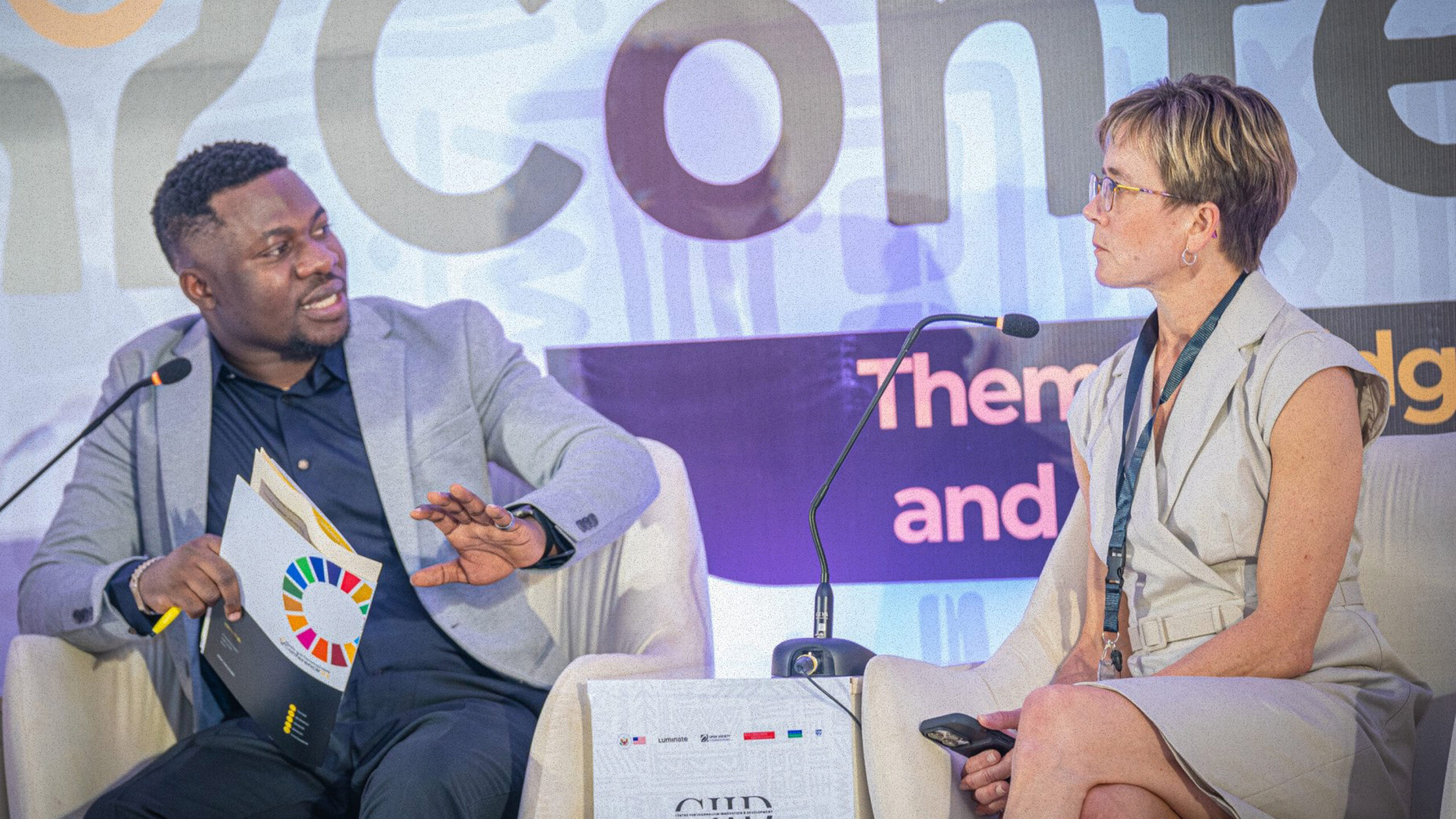 Amy Mitchell being interviewed at a conference.